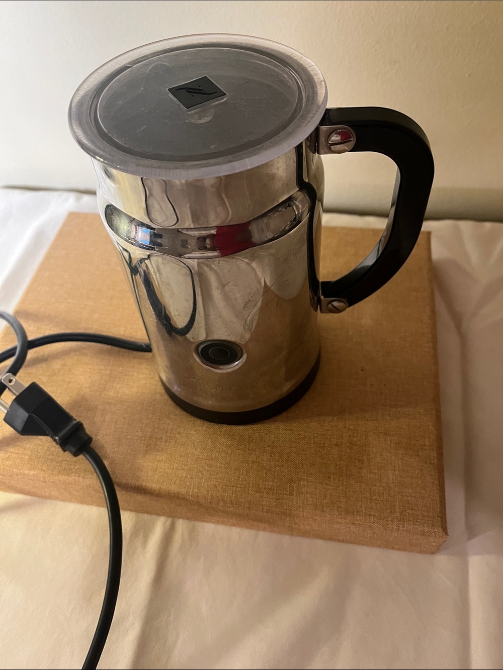 a Nespresso electric milk frother